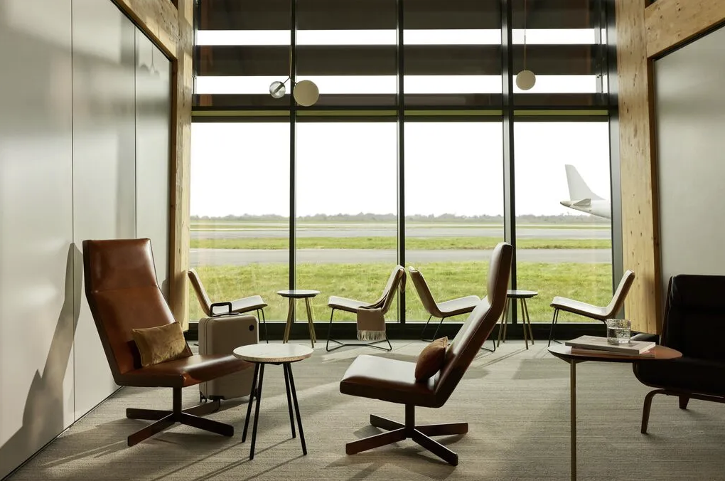 Aether private terminal lounge overlooking the runway at Manchester Airport